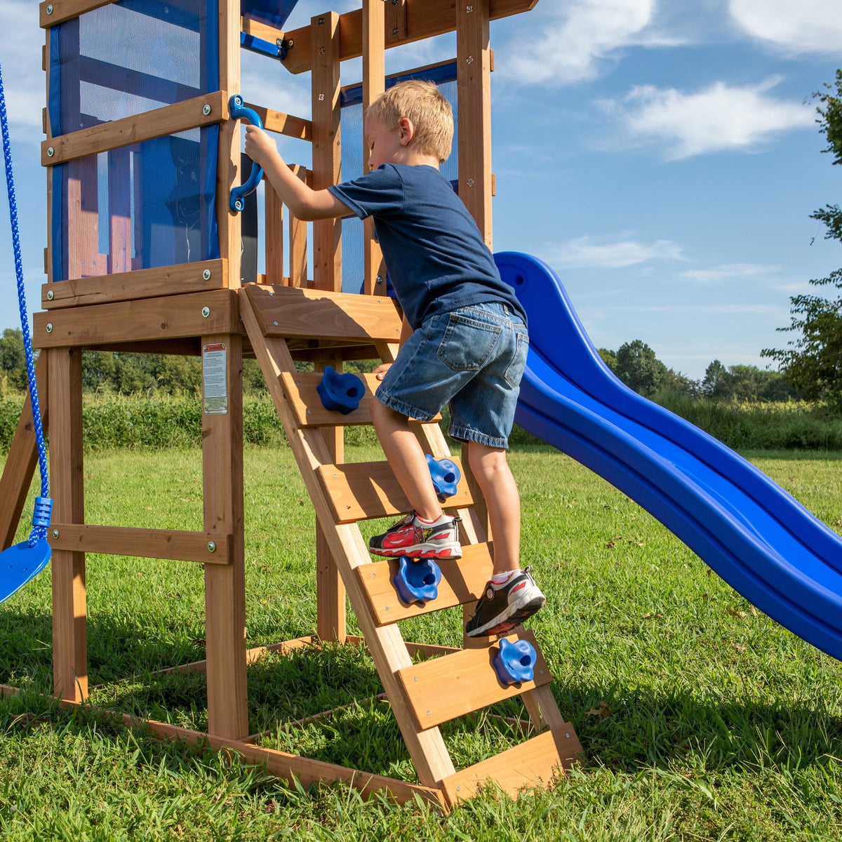 Backyard Discovery Aurora Cedar Wood Swing Set, Wave Slide, Play Deck, Rock Wall Ladder